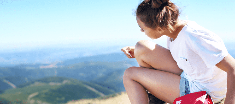 A young person travelling in the mountains