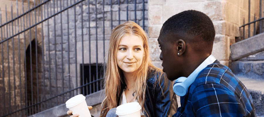 Two people walking outside, having a conversation